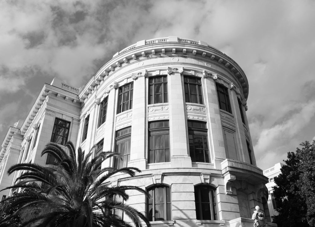 Outside the Supreme Court of Louisiana on Royal Street, in the iconic French Quarter. Features statue of Judge Edward Douglas White at the front of entrance in black white