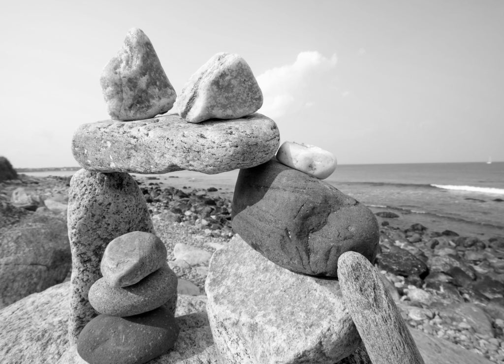 Sunset view of rocky Rhode Island sea shore in black white