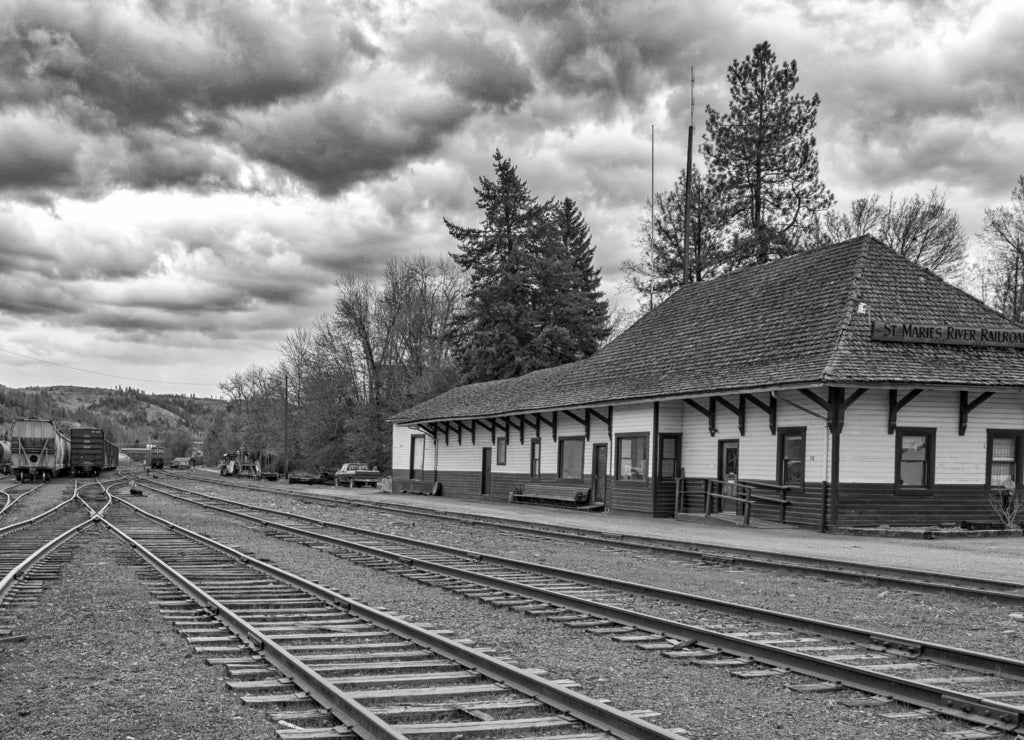 St. Maries railroad station with cloudy sky background, iDaho in black white