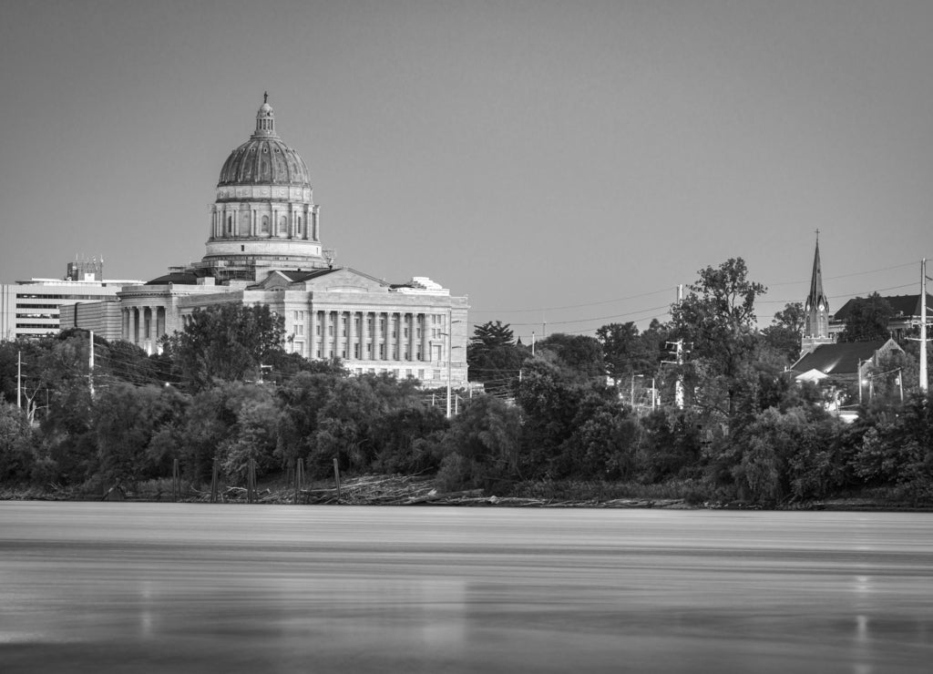 Jefferson City, Missouri, USA downtown view on the Missouri River with the State Capitol at dusk in black white