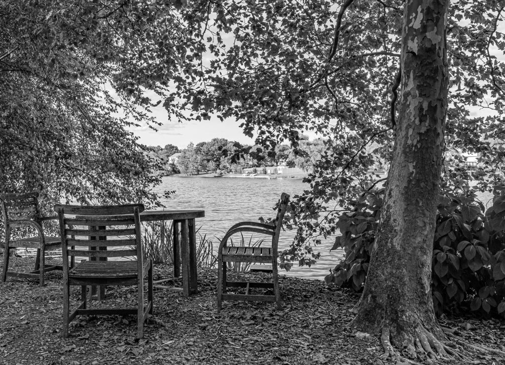 landscape with lake, table and chairs in sculpture garden New Jersey, US in black white