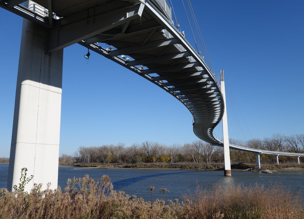 The Bob Kerrey Pedestrian Bridge crosses over the river, connecting Omaha, Nebraska with Council Bluffs, Iowa