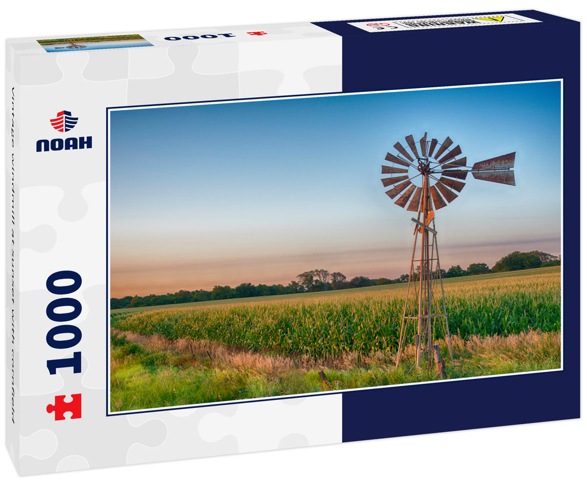 Vintage windmill at sunset with cornfield
