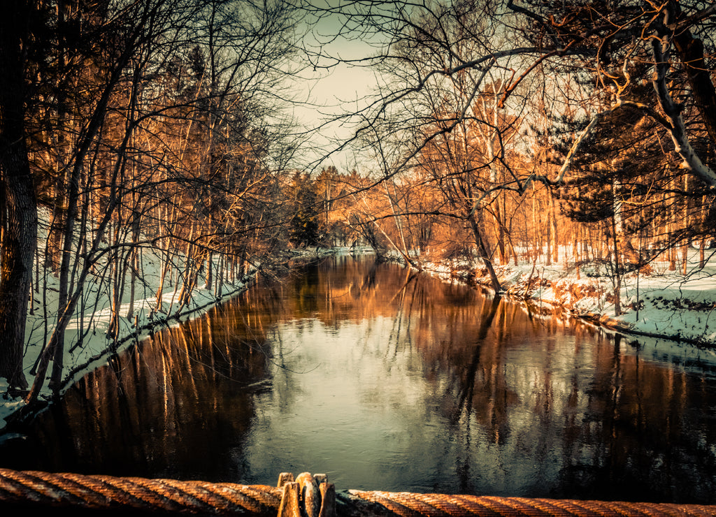 Winter view from the stone walking bridge of the Flint River in the Richfield County Park, Genesee County Parks and Recreation Richfield Township Michigan