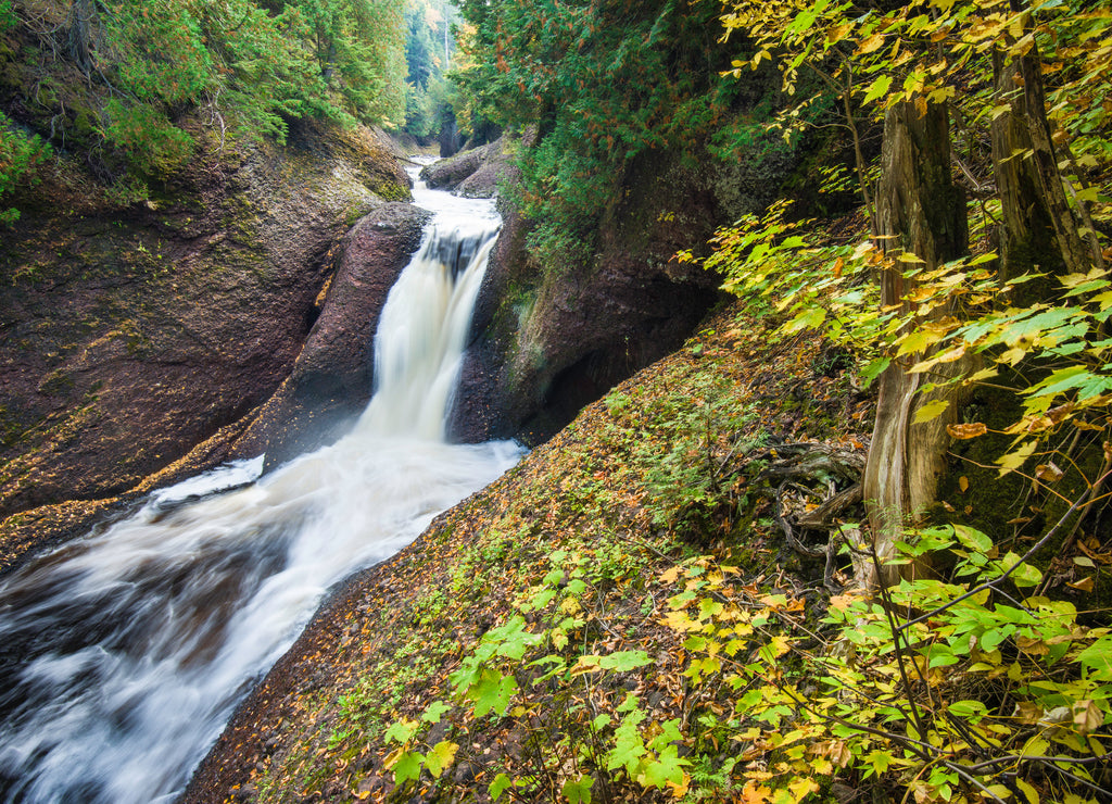 The Black River flows over Gorge Falls, just one of a series of waterfalls along the Black River Scenic Byway in Gogebic County, Michigan