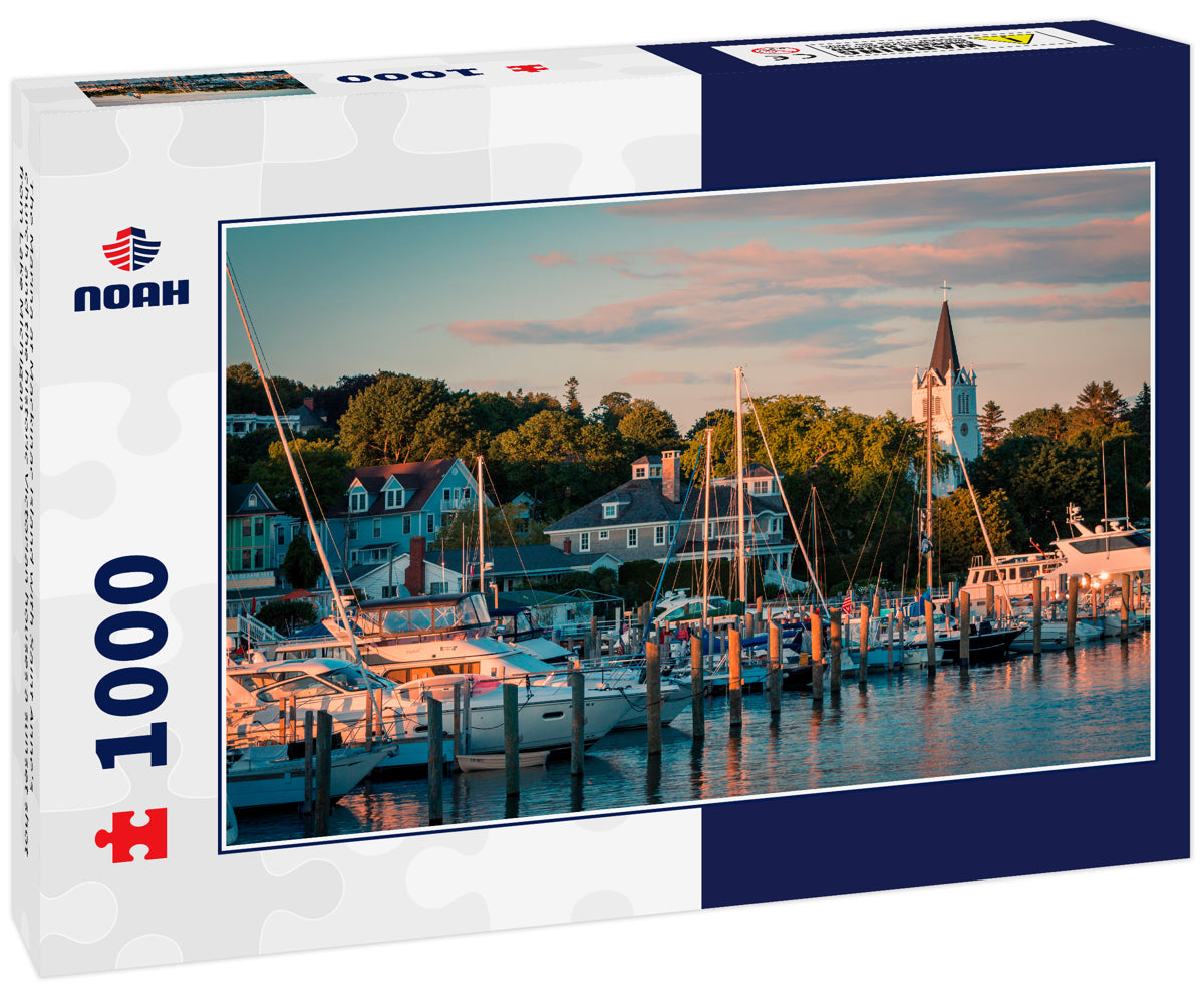 The Marina at Mackinac Island with Saint Anne's church and the historic Victorian houses a sunset shot from Lake Michigan