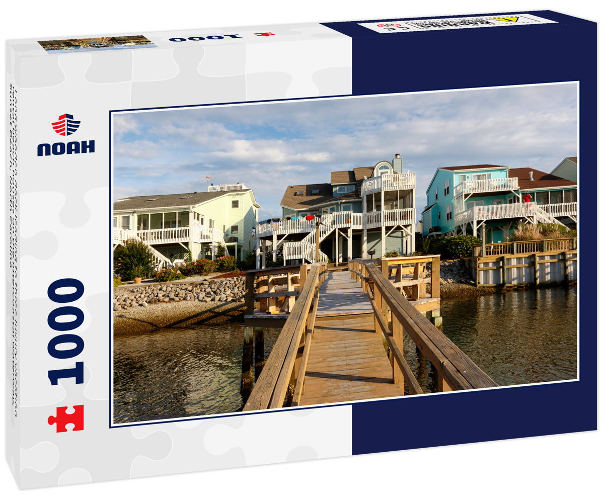 Long wooden dock leading to three luxury vacation rental beach houses on the intercoastal waterway, Sunset Beach, North Carolina