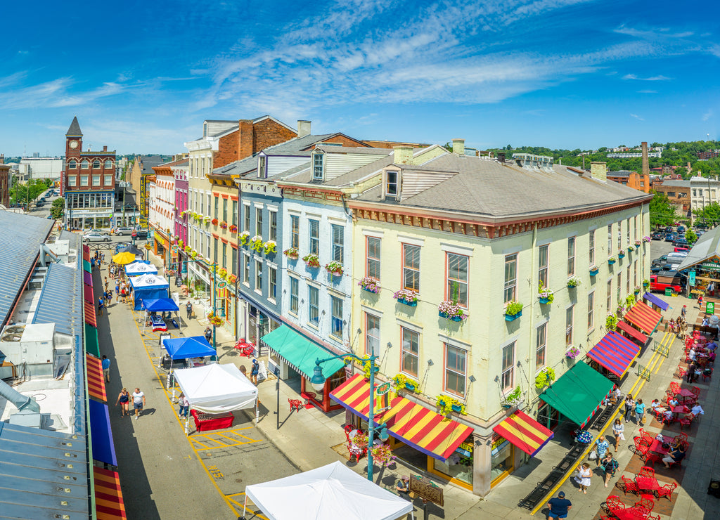 Aerial view of colorful houses at Findlay market in the re-gentrified, up and coming neighborhood Over the Rhine in Cincinnati Ohio USA with street vendors on a sunny summer morning