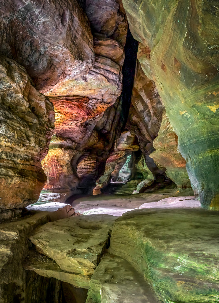 In Hocking Hills State Park, Ohio, Rock House is a twenty-five foot tall cave, on the side of a tall sandstone cliff, with seven natural Gothic-arched windows lighting its two hundred foot length