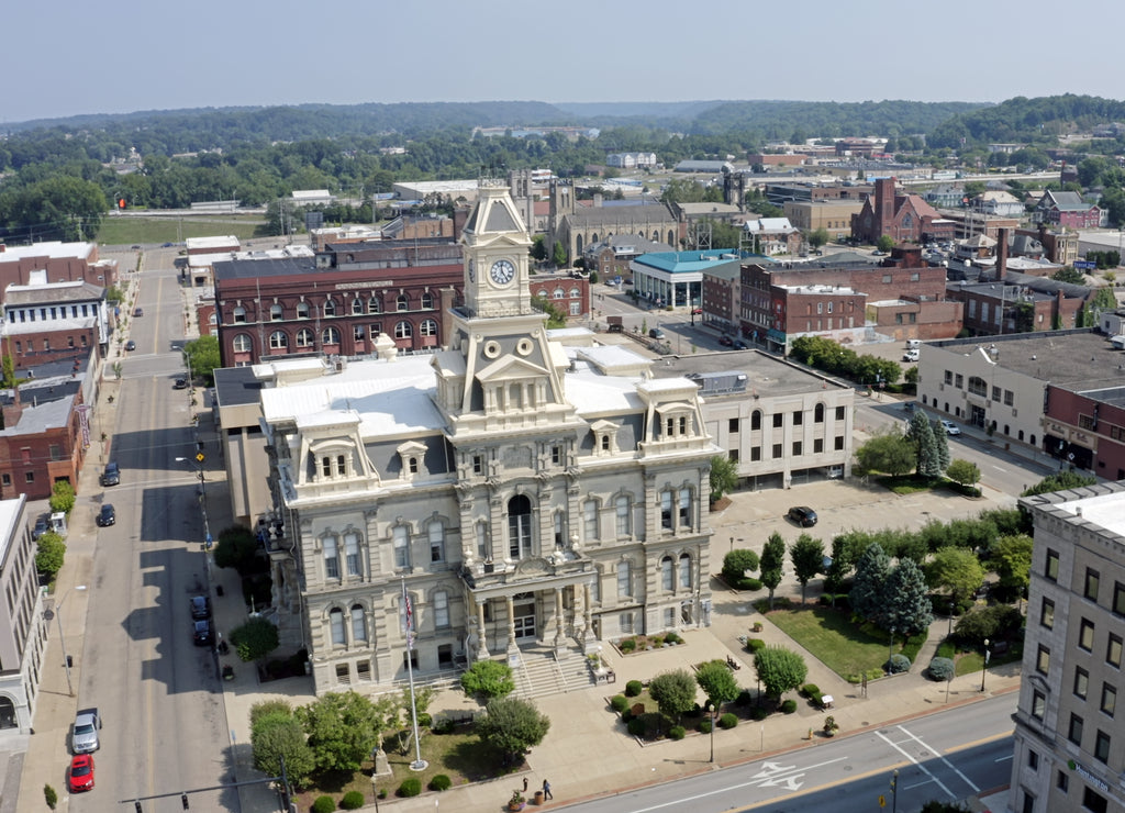 An aerial establishing shot of the Muskingum County Courthouse and clock tower in downtown Zanesville, Ohio