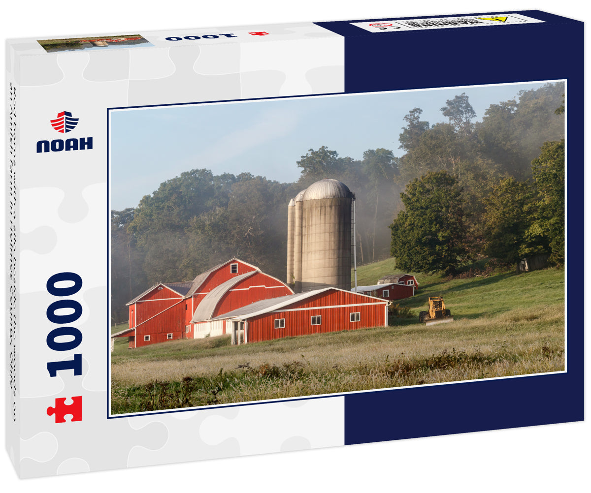 Red barns with a silo beside the woods on an Amish farm in Holmes County, Ohio
