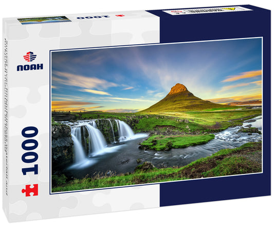 Sunset over Kirkjufellsfoss waterfall and Kirkjufell mountain in Iceland