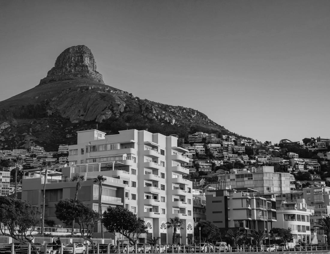 Noah Jigsaw Puzzle Norsjö, Sweden A picturesque view of a lake, a barn, a mountain and a field of yellow dandelions in summer in black white 1000 pieces