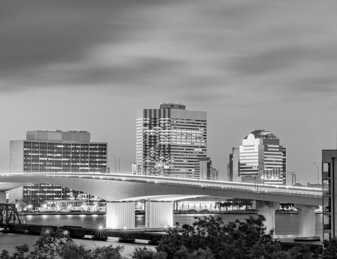 Noah Jigsaw Puzzle Woman feeding colorful fish in pond at Tirta Gangga Water Palace in Bali, Indonesia in black white 1000 pieces