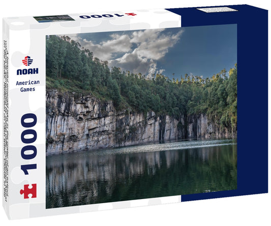 Noah Jigsaw Puzzle A beautiful emerald lake in the crater of an extinct volcano is surrounded by steep cliffs. Coniferous forest on the banks. Reflection on calm water. Clouds in the blue sky. Tritriva lake. Madagascar 1000 pieces