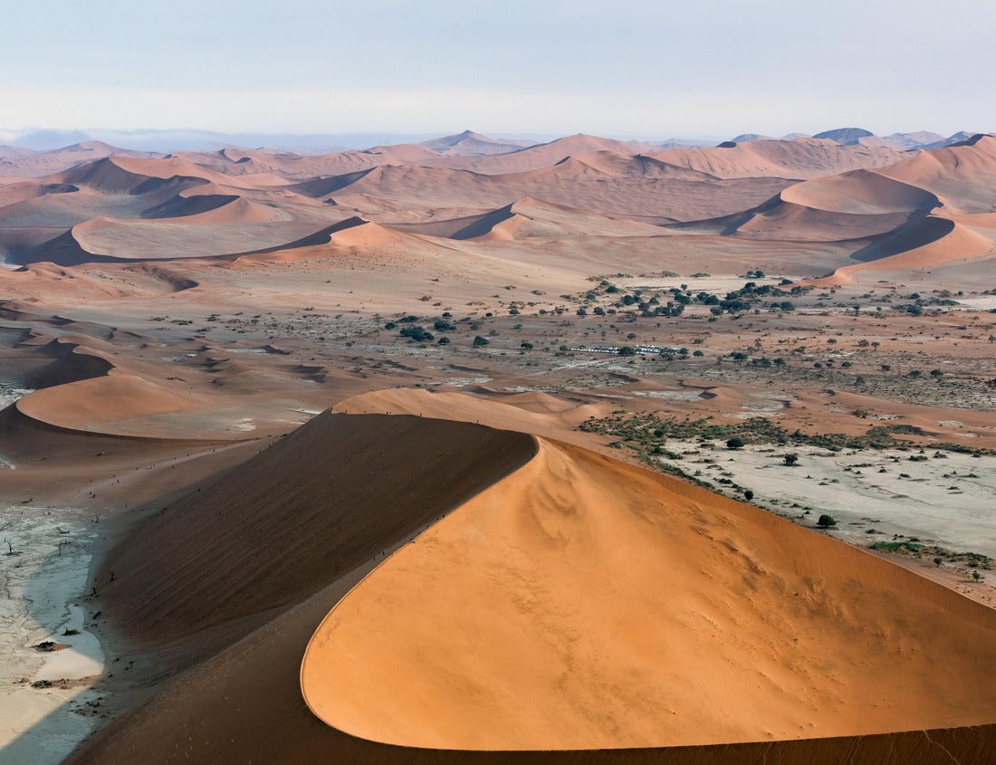 Noah Jigsaw Puzzle Namibia landscape with sand hills and dunes in Sossusvlei, Namib-Naukluft National Park, Namibia. Panorama of Namib desert with tourists walking up to red sand dunes at sunrise 1000 pieces