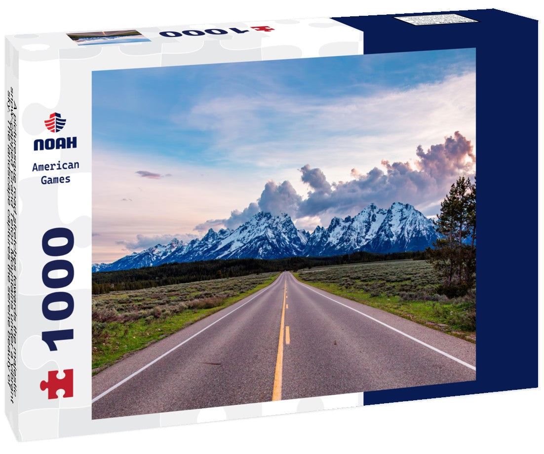 Noah Jigsaw Puzzle A picturesque road stretches towards the majestic, snow-capped Grand Teton Mountains under a vibrant sky. The landscape captures the serene beauty of Wyoming, evoking feelings of adventure 1000 pieces