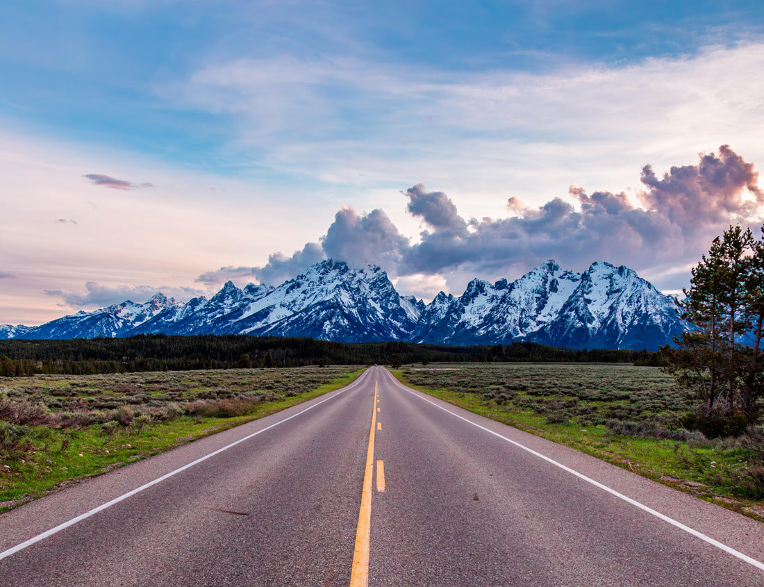 Noah Jigsaw Puzzle A picturesque road stretches towards the majestic, snow-capped Grand Teton Mountains under a vibrant sky. The landscape captures the serene beauty of Wyoming, evoking feelings of adventure 1000 pieces