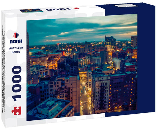 Noah Jigsaw Puzzle Cityscape of Detroit Michigan glowing at sunrise. Historic architecture, commercial buildings, apartments, skyscrapers and other structures in the foreground. Cloudy blue gray sky with hints of orange 1000 Pieces