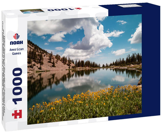 Noah Jigsaw Puzzle Yellow flowers on the edge of Johnson Lake, an alpine lake in the Snake Range, located inside Great Basin National Park in Nevada, seen on a summer day. Large cumulus clouds are seen in the blue sky 1000 Pieces