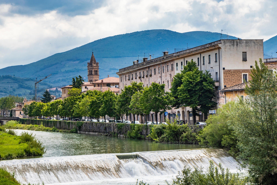 A view of Foligno, crossed by the river Topino, a bell tower rises above the roofs of the houses. The cloudy sky at sunset 2000pc Puzzle