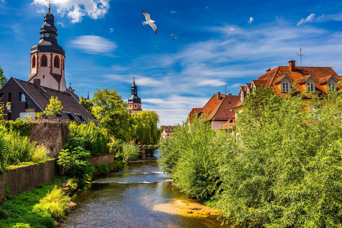 Old city of Ettlingen in Germany with a river and a church. View of a central district of Ettlingen, Germany, with a river and a bell tower of a church 2000pc Puzzle