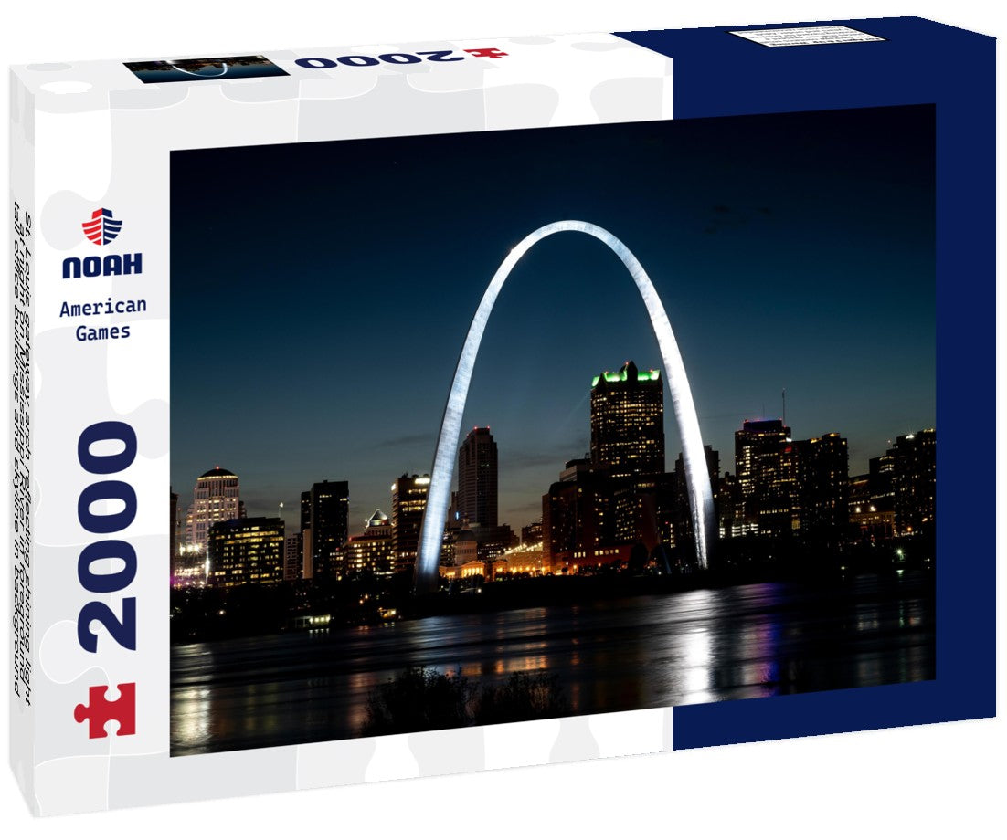 St. Louis gateway arch reflecting shining light at night on Mississippi River in foreground, tall office buildings and skyline in background 2000pc Puzzle