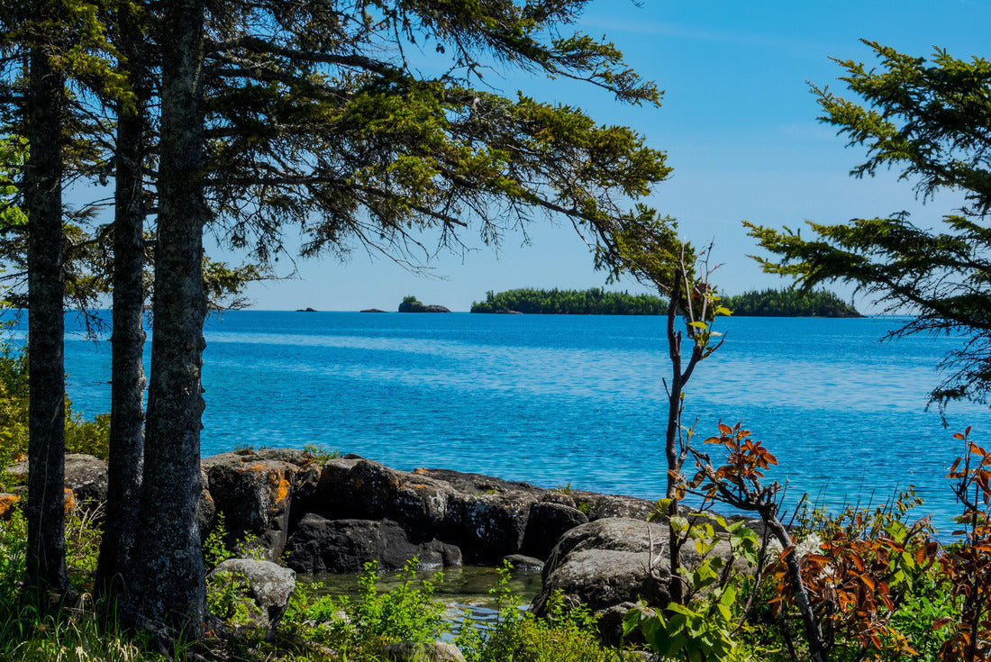 A view through the forest shows several of the tiny islands off the main island of Isle Royale NP in Lake Superior off Copper Harbor, MI. Large boulders surround a little water pool on shoreline 2000pc Puzzle