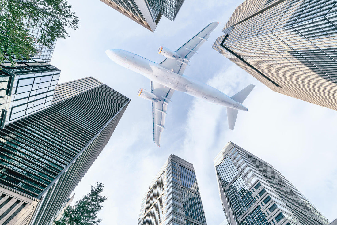 Aircraft flying above glass office buildings in the sky over city buildings in financial district of Tokyo city, Japan 2000pc Puzzle
