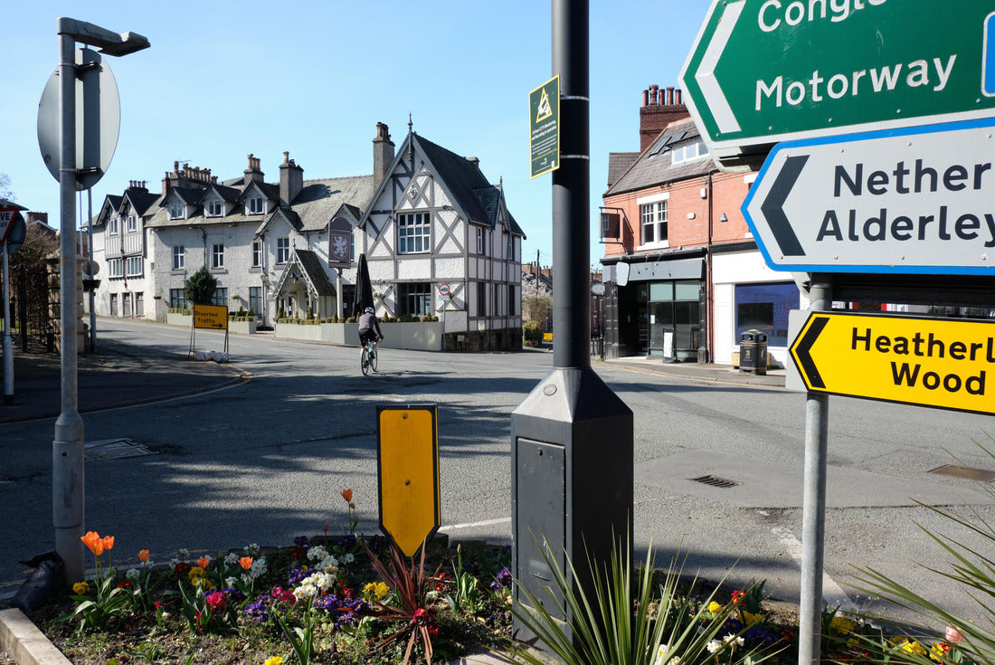 Alderley Edge (town), Cheshire, England, United Kingdom, street signs, shops and public house near the town center, with street border flowers and a cyclist 2000pc Puzzle