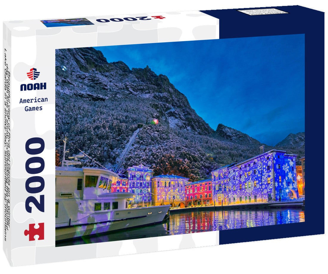 Noah Jigsaw Puzzle Beautiful view of Riva del Garda on a winter day with lots of snow, overlooking the beautiful Lake Garda in a snowy day, surrounded by mountains, Trentino Alto Adige region 2000 pieces
