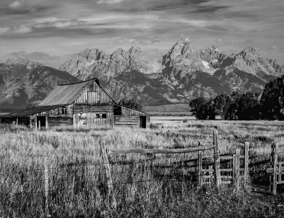 Noah Jigsaw Puzzle Fort Union National Monument in New Mexico. Preserves fort's adobe ruins along Santa Fe Trail. Remnants of Fort Union Depot Mechanic's Corral with wagons and wagon wheels in black white 1000 pieces