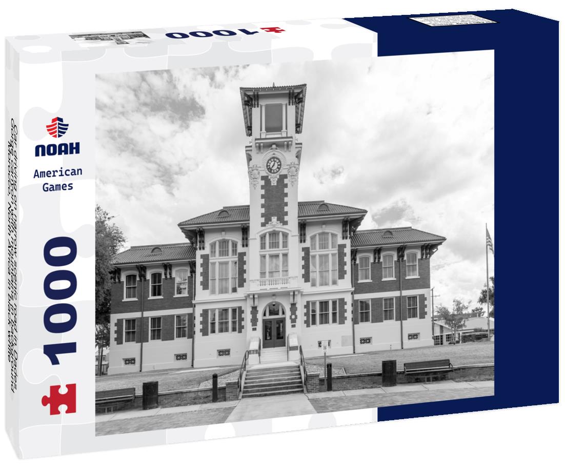 Noah Jigsaw Puzzle Car driving on narrow scenic road in Dades Gorge canyon with mountains in background, Morocco, North Africa in black white 1000 pieces