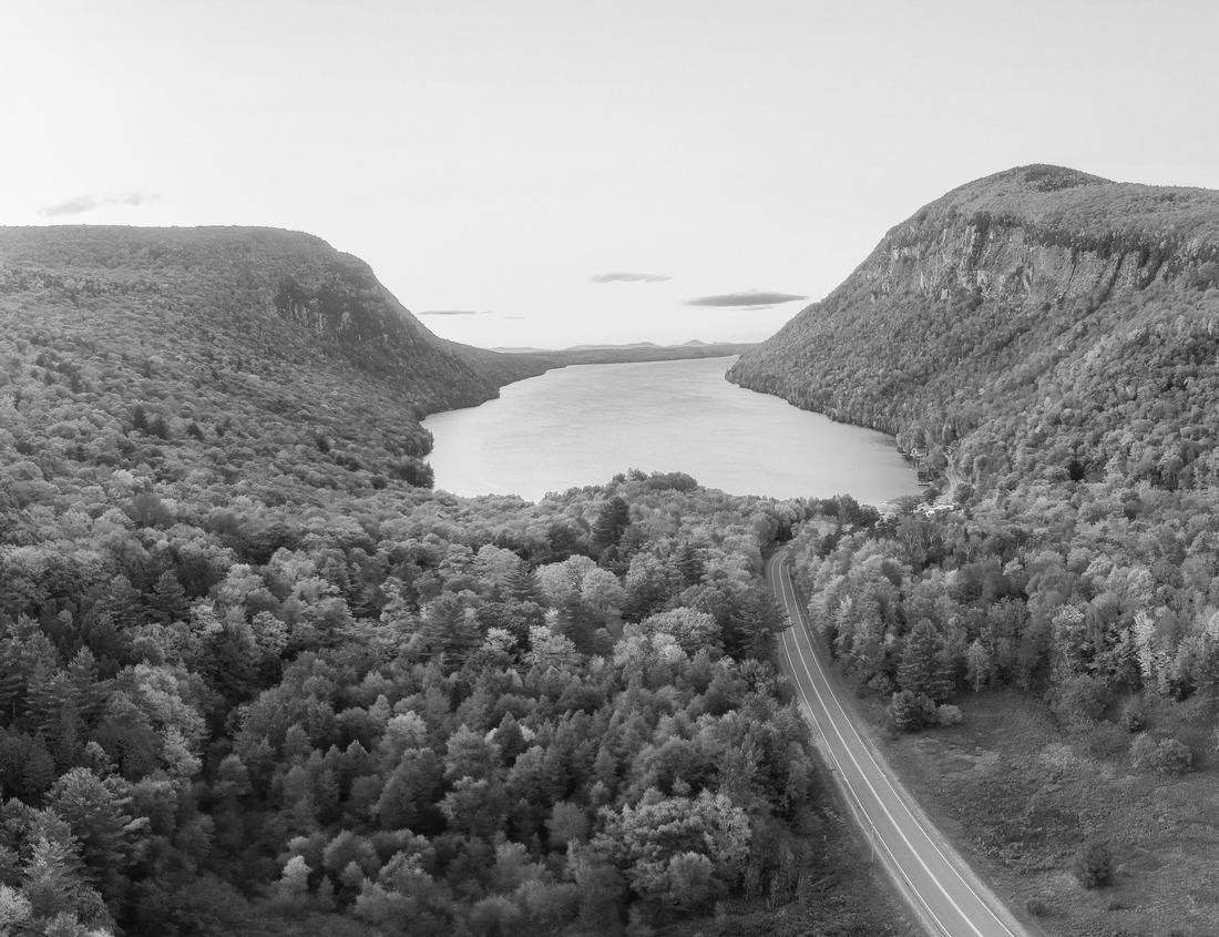 Noah Jigsaw Puzzle A wide-angle view of flame azaleas and spruce-fir trees on Round Bald, with the backdrop of the Appalachian Mountains of North Carolina and Virginia and a clear blue sky with clouds in black white 1000 pieces