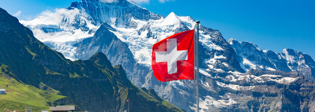 Noah Jigsaw Puzzle Swiss flag thrower and tourists admiring the peaks of Monch and Jungfrau mountains on a lookout point Mannlichen, Berner Oberland Switzerland panorama 1000 pieces