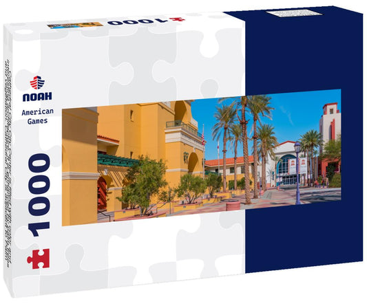 Noah Jigsaw Puzzle Cathedral City City Center is filled with color and interesting architecture. It is enhanced by palm trees and vegetation. Cathedral City is adjacent to Palm Springs in the southern California desert panorama 1000 pieces
