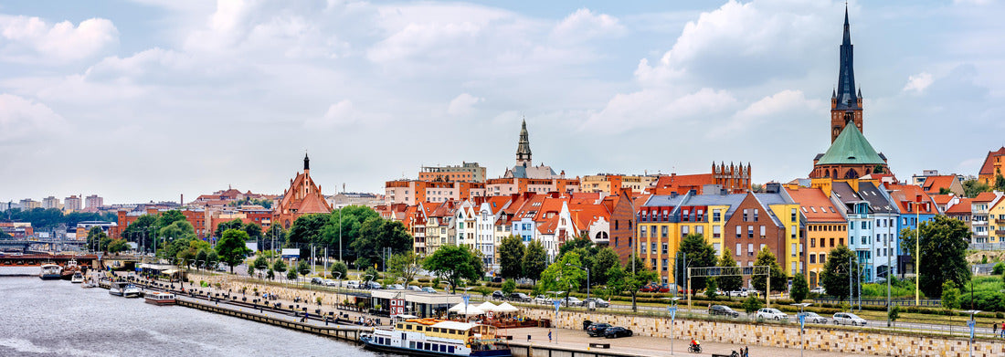 Noah Jigsaw Puzzle Ships anchored on the Odra River. People relax on Piastowski Boulevard. St. James's Basilica, with the Apostolska Tower in the background, Szczecin, Poland panorama 1000 pieces