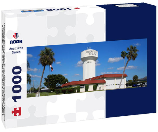Noah Jigsaw Puzzle Deerfield Beach Water Tower Identifying Sign at Broward Sheriff and Fire Station Framed by Two Palm Trees, a Sidewalk and the Street in a Sunny Day in January panorama 1000 pieces