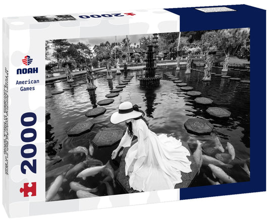 Noah Jigsaw Puzzle Woman feeding colorful fish in pond at Tirta Gangga Water Palace in Bali, Indonesia in black white 2000 pieces