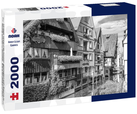Noah Jigsaw Puzzle Vintage street with houses decorated with flowers in the old town of Ulm, Germany. Beautiful view of the historic fishing quarter in summer. It is a landmark of Ulm. Old town of Ulm with canals in black white 2000 pieces