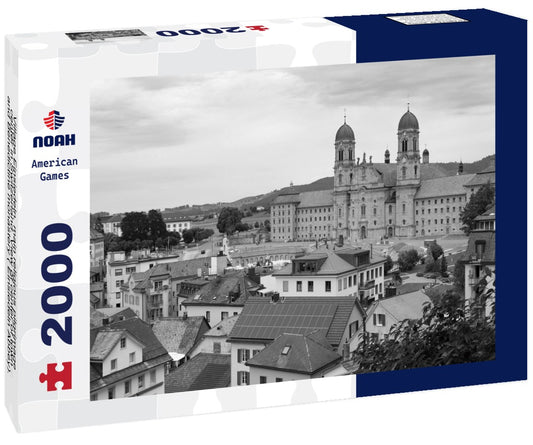 Noah Jigsaw Puzzle Village Einsiedeln, main religious pilgrimage center in Switzerland. View of center of town and Benedictine monastery ( Einsiedeln Abbey). Tourist destination in black white 2000 pieces