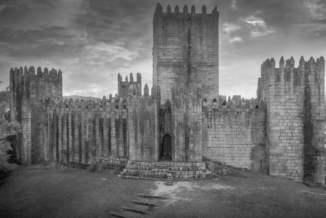 Aerial view of well-preserved medieval buildings hilltop, 10th-century Guimarães Castle with stunning sunset orange sky 2000pc PuzzleBlack and White