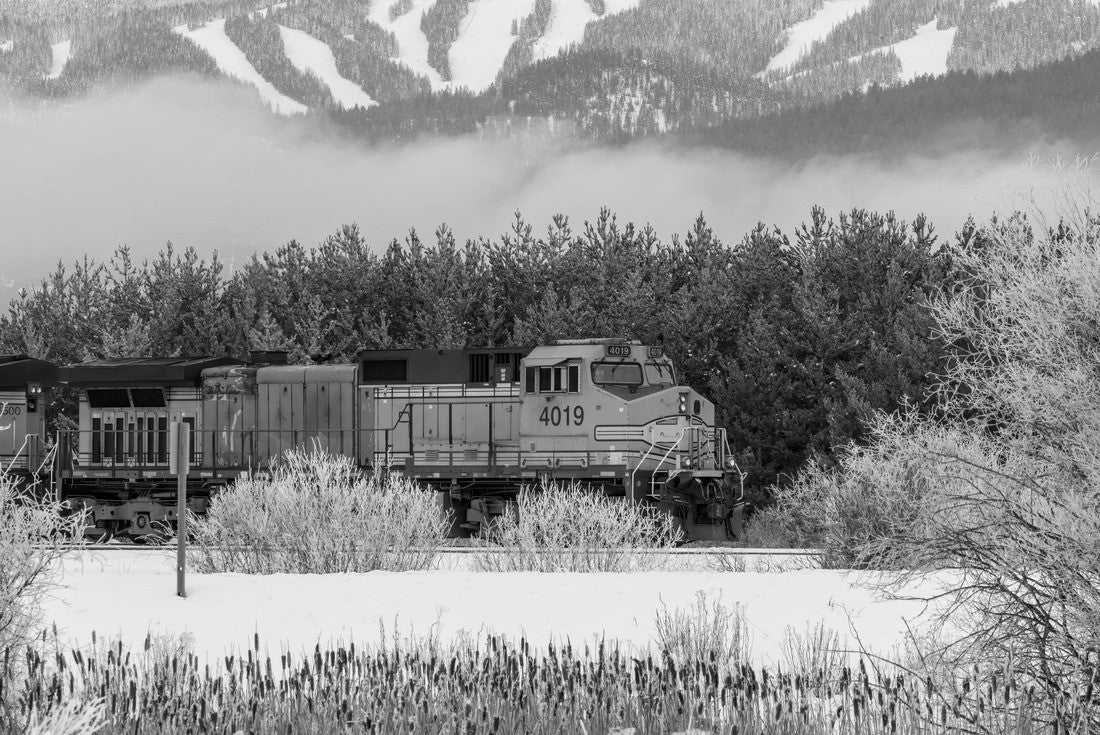 Locomotive pulling train in winter close to Whitefish, Montana with Whitefish ski resort in background 2000pc PuzzleBlack and White