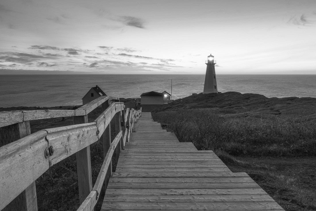wooden staircase and boardwalk on a beautiful sunrise, overlooking a white lighthouse at the edge of a rocky cliff. Cape Spear National Historic Site, St Johns Newfundland 2000pc PuzzleBlack and White