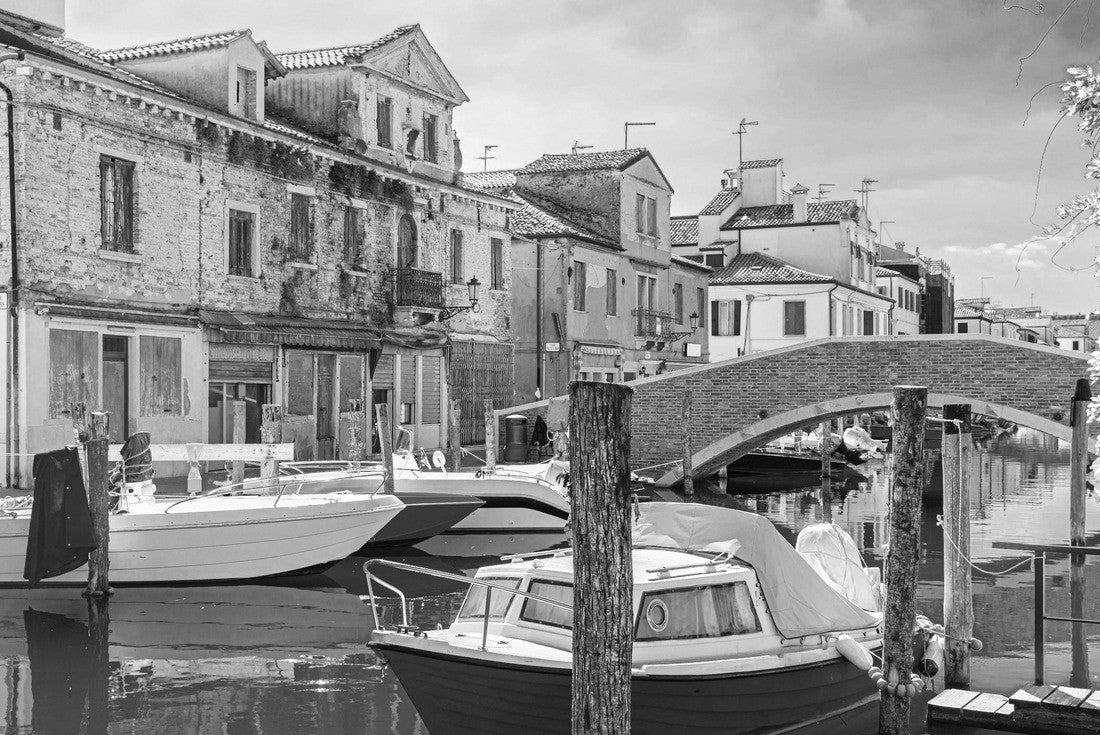 Chioggia cityscape with narrow water canal with colorful multicolored boats and yachts between old colorful buildings and brick bridge, blue sky background in summer, Veneto region, northern Italy 2000pc PuzzleBlack and White
