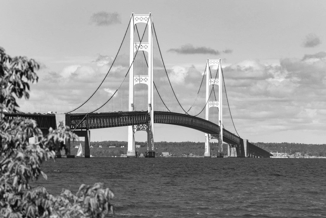 The Mackinac Bridge on a summer day. A suspension bridge over the Straits of Mackinac connecting the Upper and Lower Peninsulas of Michigan. Puff clouds in the blue sky 2000pc PuzzleBlack and White