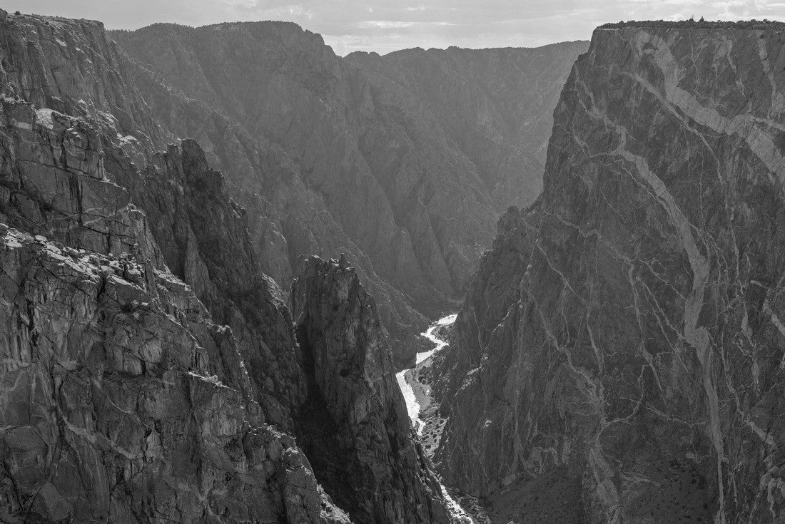 Steep granite cliffs of the Black Canyon of the Gunnison with the two dragons and the mysterious Gunnison River cutting through the rock in the valley, Colorado, USA 2000pc PuzzleBlack and White