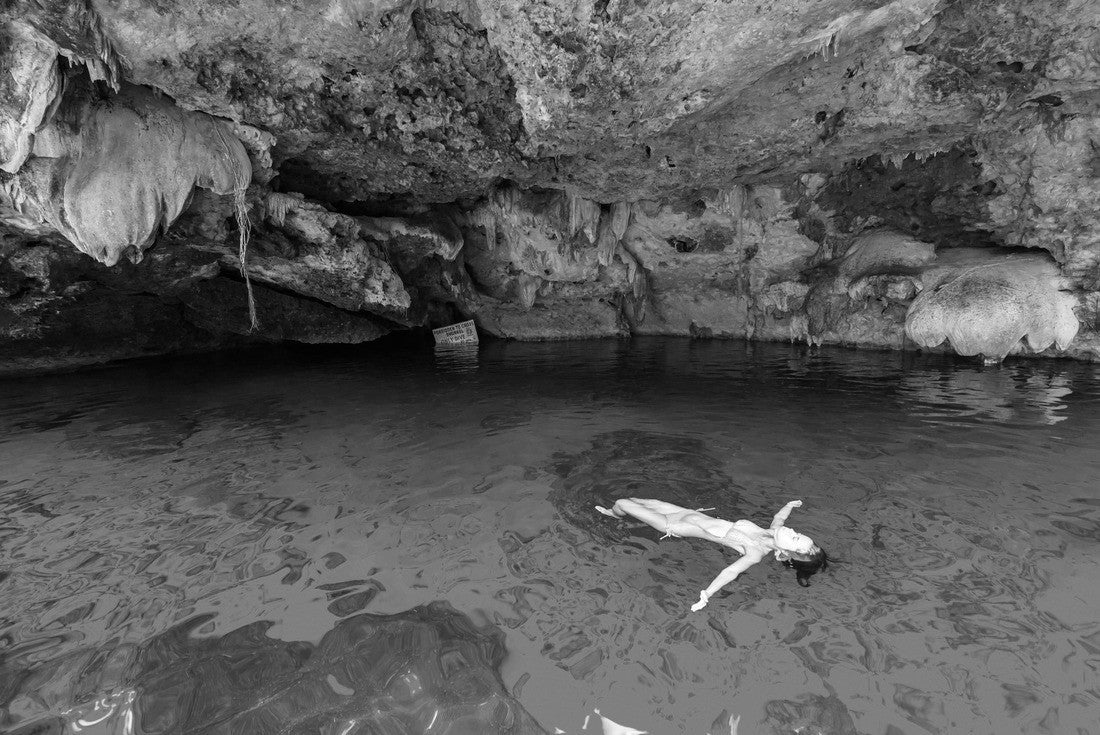 Cenote Dos Ojos in Quintana Roo, Mexico. People swimming and snorkeling in clear blue water. This cenote is located near Tulum on the Yucatan Peninsula, Mexico 2000pc PuzzleBlack and White