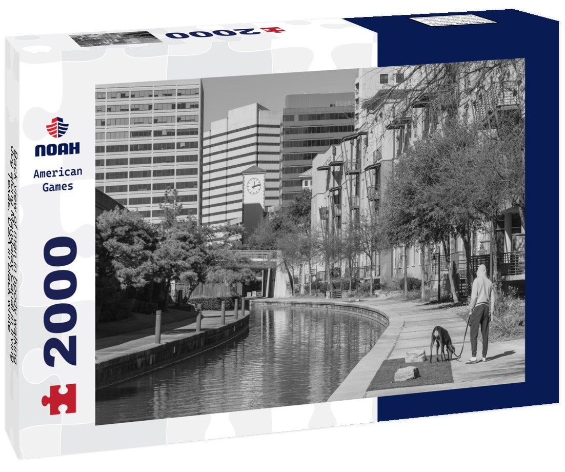 Back view of man in hoody walking dog along Mandalay Canal in Irving, Texas, USA 2000pc PuzzleBlack and White