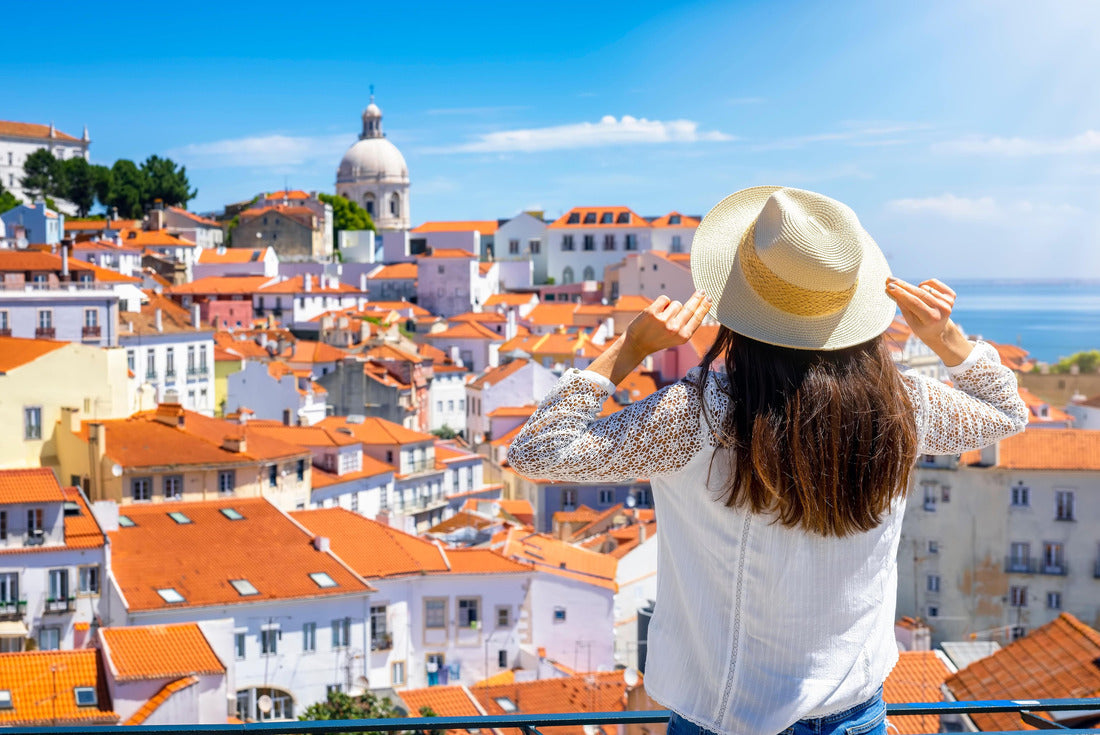 A tourist woman looks at the beautiful cityscape of Lisbon, with the colorful houses and roofs at the Alfama district, Portugal 2000pc Puzzle